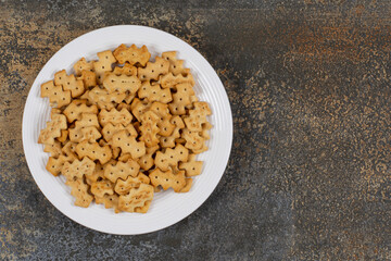 Set of salty crackers on white plate