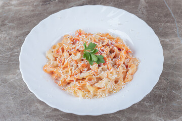 Farfalle pasta with bolognese on the bowl , on the marble background