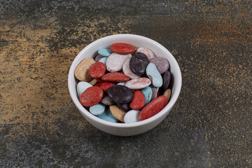 Oval shaped stone candies in white bowl