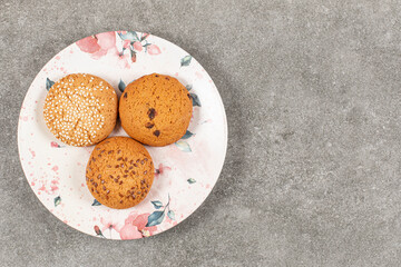 Top view of sweet cookies on white plate