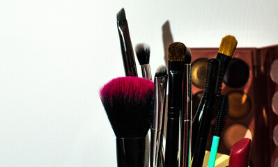 Make up accessories on white background, brushes, beauty