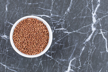 Close up raw buckwheat . Gluten free ancient grain for healthy diet