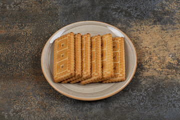 Pile of tasty biscuits on ceramic plate