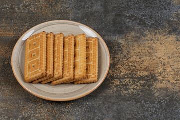 Pile of tasty biscuits on ceramic plate