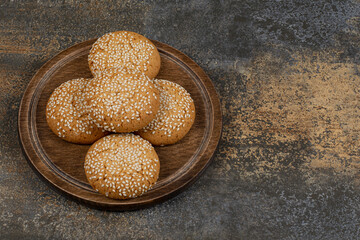 Cookies with sesame seeds on wooden board
