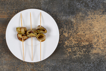Fried eggplants in sticks on white plate