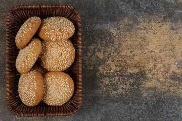Cookies with sesame seeds in wooden basket