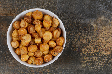 Salted tasty crackers in white bowl