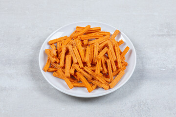 Close up photo of fresh chips on white plate