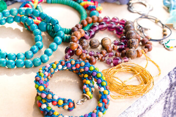 Retro style jewelry, vintage and handmade stone and wooden bracelets at flea market or garage sale - vintage jewellery. Selective focus