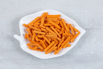 Close up photo of french fries on white bowl