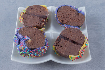 Four homemade fresh cookie on white plate