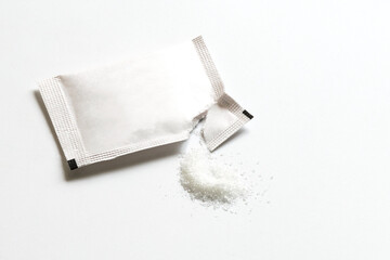 Sugar stick, Empty mock-up paper kraft packaging, white Sachet Be ripped, and sugar on white...
