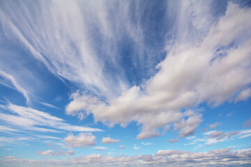Blue sky that looks vast and long with great perspective and puffy white clouds