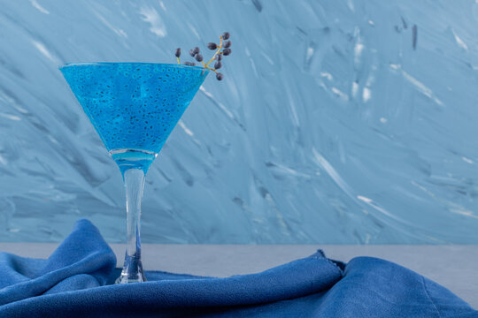 Close up photo of Iced blue cosmopolitan cocktail.
