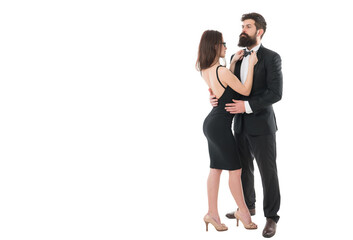 Being together. formal couple grooming for formal event. woman fix bow at males tuxedo. brutal man embrace his lady. couple in love. business meeting and partnership. love and romance