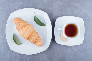 Top view of Tea and croissants. Classic breakfast