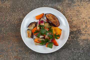Tasty grilled vegetables on white plate