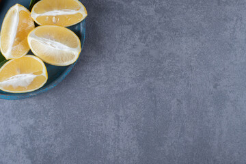 Top view. Of fresh lemon slices on grey background