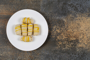 Bunch of creamy biscuits on white plate