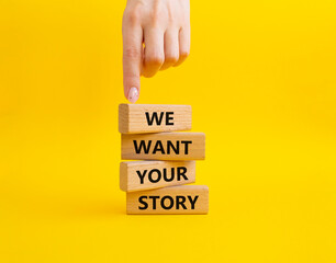 We want your story symbol. Concept words We want your story on wooden blocks. Beautiful yellow background. Businessman hand. Business and We want your story concept. Copy space.