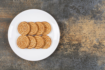 Sesame seeds biscuits on white plate