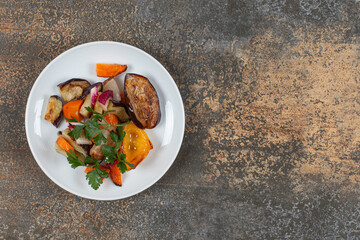 Tasty grilled vegetables on white plate
