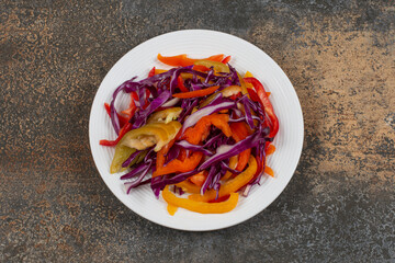 Various sliced vegetables on white plate