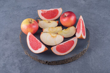 Fresh season fruits. Grapefruit slices and apples