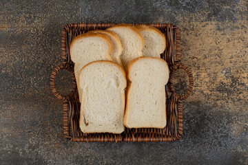 Homemade white bread in wooden basket