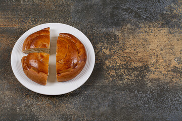 Sliced fresh pastry on white plate