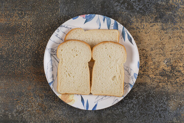 Sliced toast bread on colorful plate