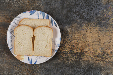 Sliced toast bread on colorful plate