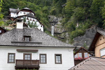 Fototapeta na wymiar historic houses closeup view Hallstatt waterfall Austria