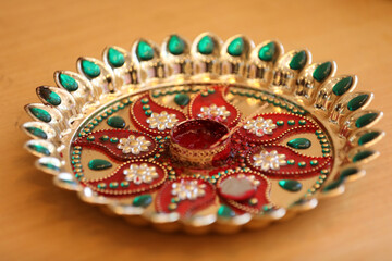 The plate used in the Tilak ceremony has different components depending on the region or culture of the respective families