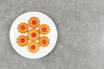 Homemade cookies with jelly on white plate