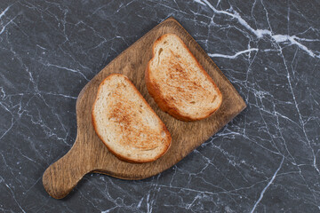 Delectable fried bread on board , on the marble background