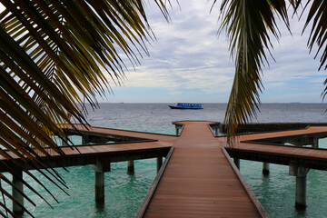 View of the pier and the ocean on a resort island in the Maldives