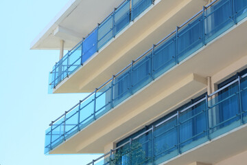 Fototapeta premium Exterior of beautiful residential building with balconies, low angle view