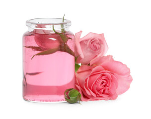 Bottle of essential rose oil and flowers on white background