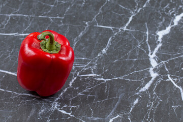 Fresh red pepper on marble background