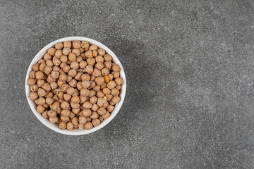 Dry yellow peas in white bowl