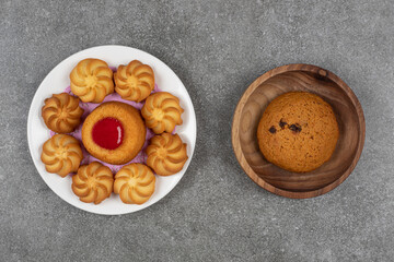 Delicious sweet biscuits on white plate