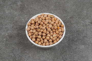 Dry yellow peas in white bowl