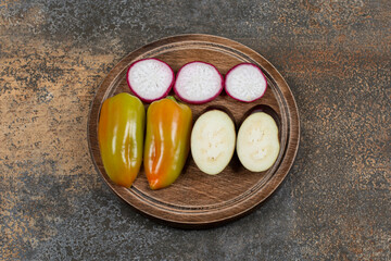 A small portion sliced vegetable, on the marble background