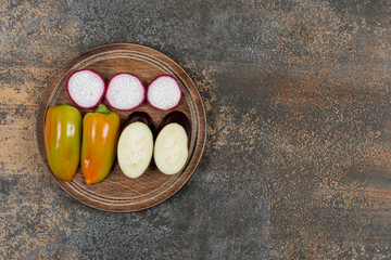 A small portion sliced vegetable, on the marble background