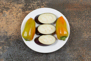  Ready to cook vegetable on the plate, on the marble background