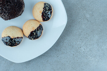 Delicious cookies with chocolate frosting and sprinkles