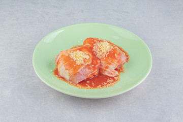 Ketchup meat with spice on the plate , on the white background