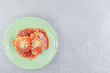 Ketchup meat with spice on the plate , on the white background